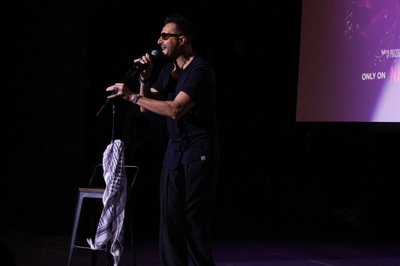 Asim Khan doing crowd work at the microphone