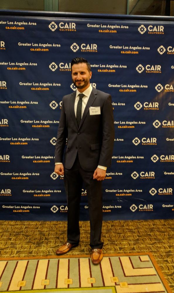 Asim Khan at a community organization dinner