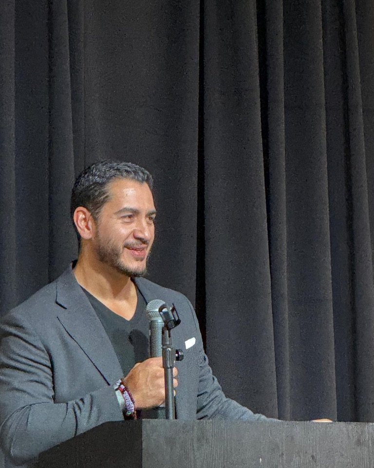 Abdul El-Sayed smiling at the lectern