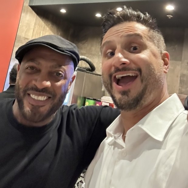 Asim Khan and comedian Omar Regan taking a selfie at the after party