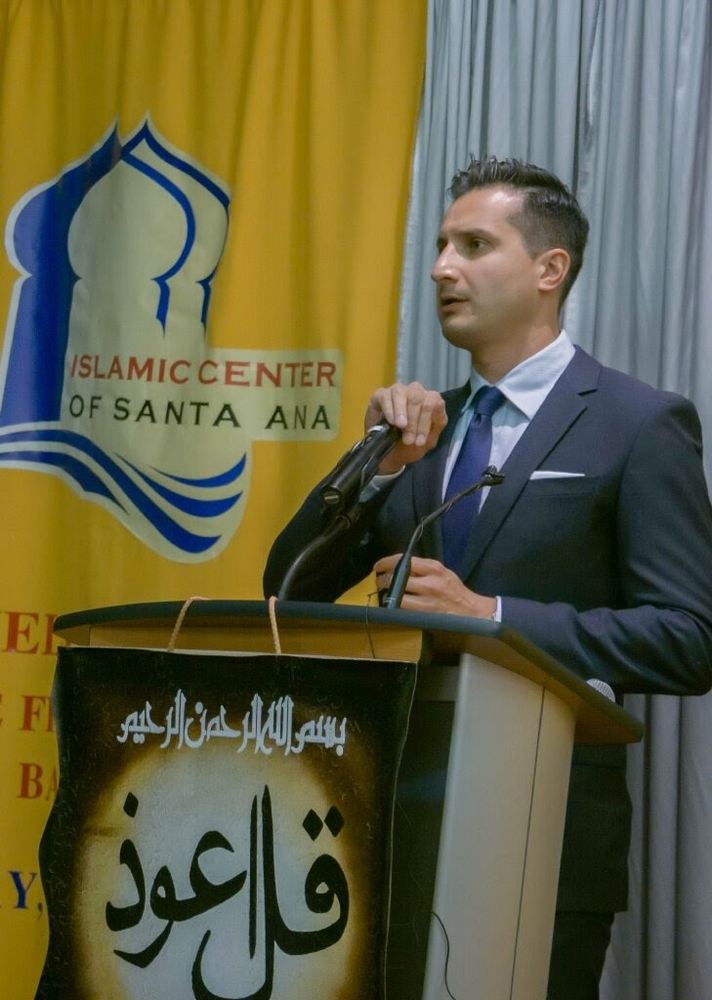 Asim Khan at the lectern at Islamic Center of Santa Ana