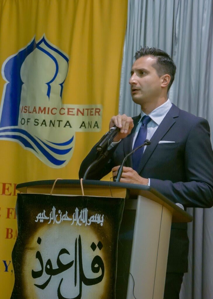 Asim Khan at the lectern at Islamic Center of Santa Ana