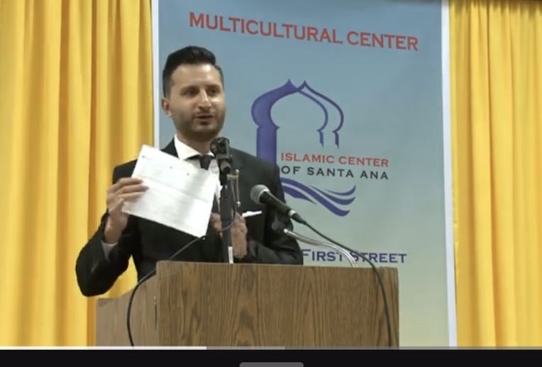 Asim Khan presenting at a community program